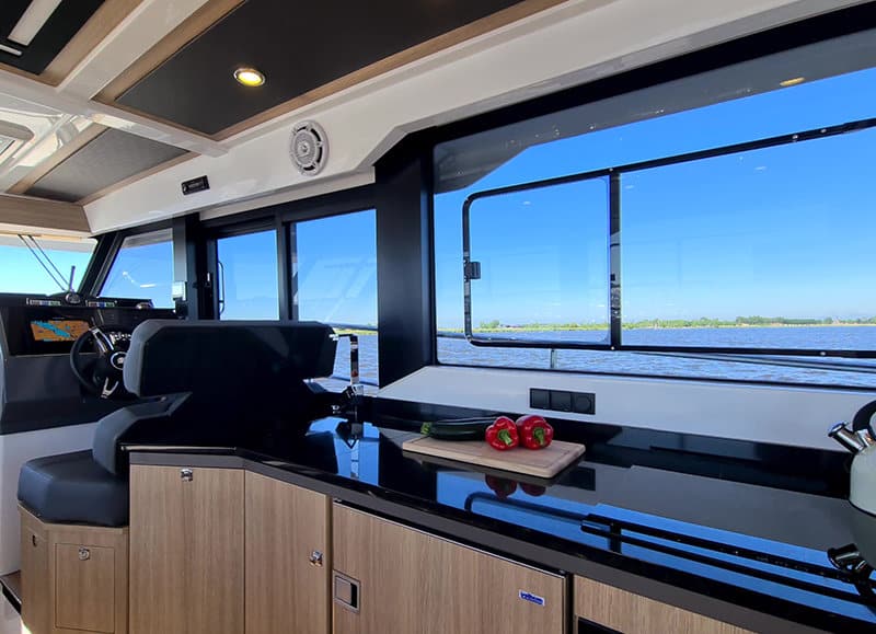 Kitchen on the Northman 1200 Electric with induction hob, oven, fridge, and wide views